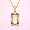 Collar con dije champagne/morado