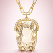 Dije octagonal champagne con detalles en cristales blancos